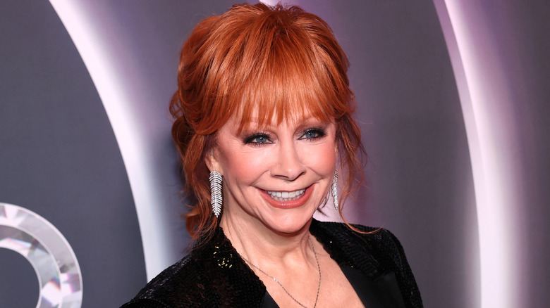 Reba McEntire smiling and posing