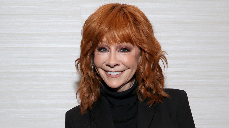 Reba McEntire poses in 2024