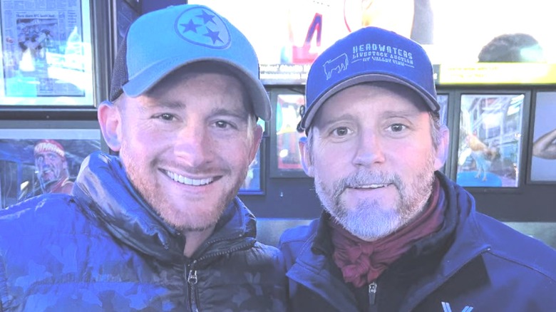 Shelby and Brandon Blackstock smiling in baseball caps