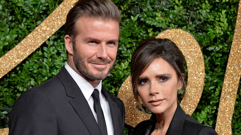 David and Victoria Beckham smiling