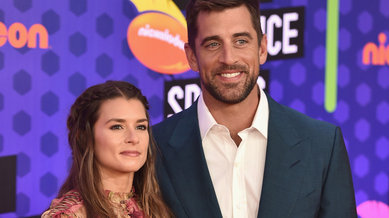 Danica Patrick and Aaron Rodgers smiling 
