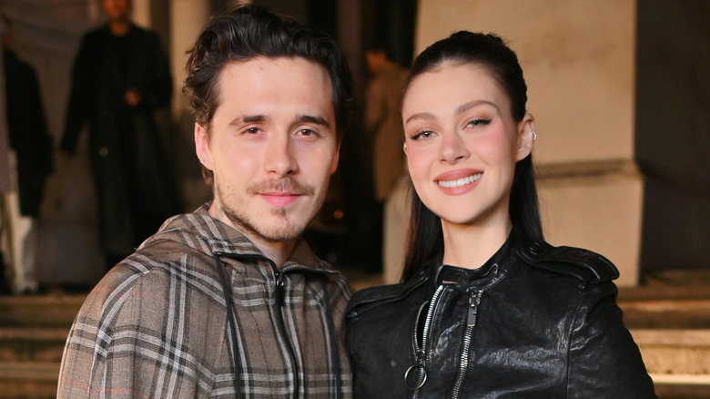 Brooklyn Beckham and Nicola Peltz posing