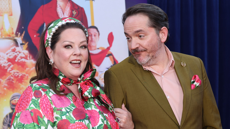 Melissa McCarthy and Ben Falcone posing at a Netflix premiere.