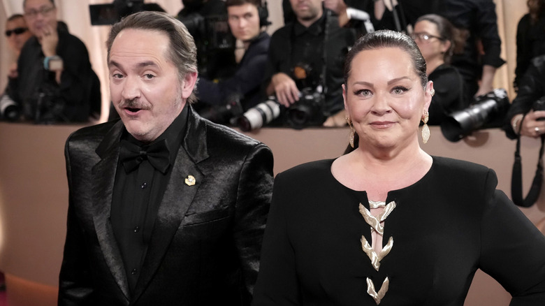 Melissa McCarthy and Ben Falcone attend the 2026 Golden Globes.