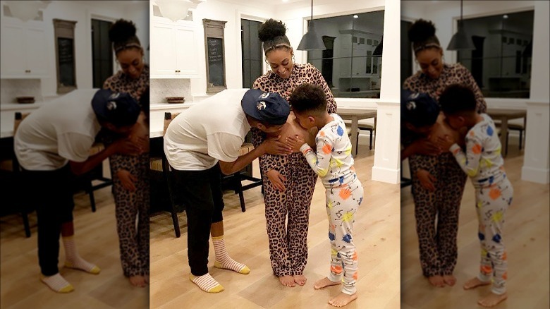 Cory Hardrict and Cree kiss Tia Mowry's bump