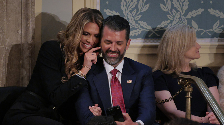 Donald Trump Jr. posing for selfies as his new girlfriend Bettina Anderson is tickling his face before the president's address to a joint session of Congress
