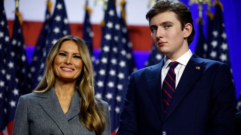 Melania Trump and Barron Trump standing on stage