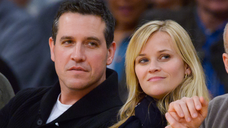 Reese Witherspoon and Jim Toth frowning 