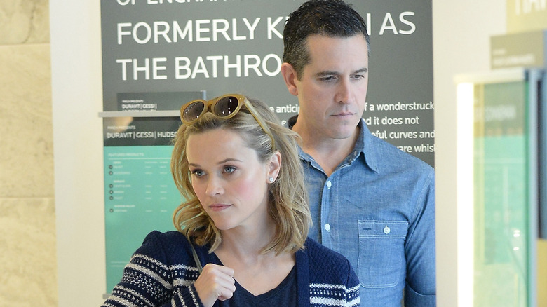 Reese Witherspoon and Jim Toth frowning 