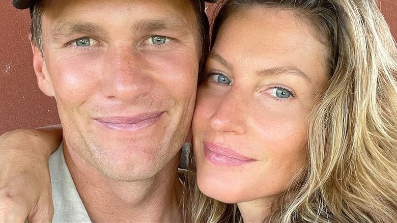 Gisele Bundchen cuddling Tom Brady