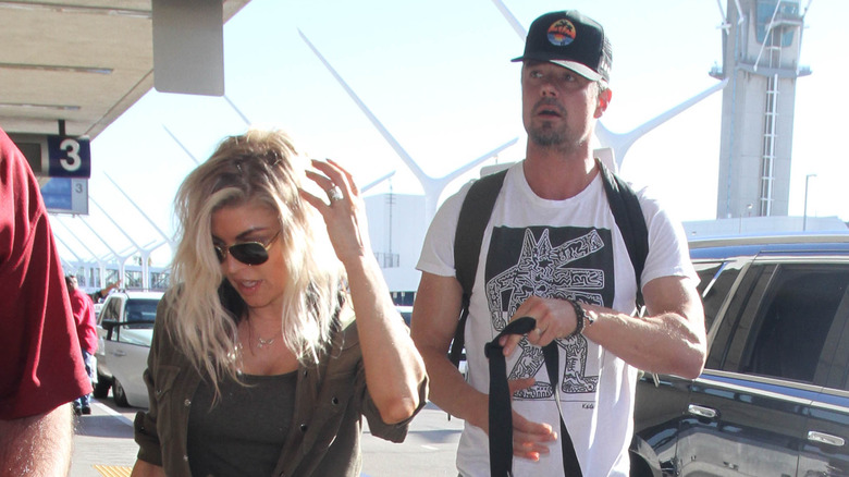 Fergie and Josh Duhamel walking