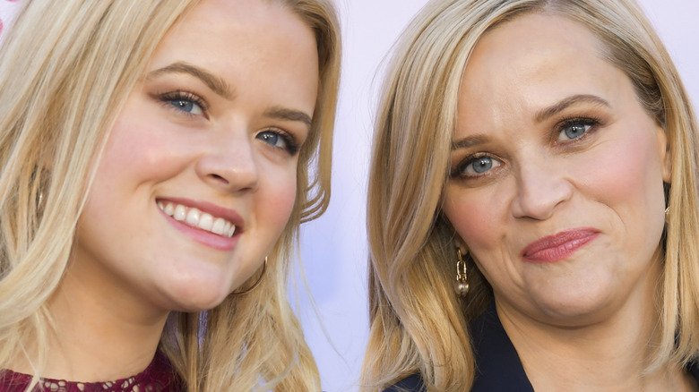 Ava Phillippe and Reese Witherspoon smile on the red carpet