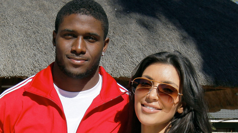 Reggie Bush and Kim Kardashian smiling