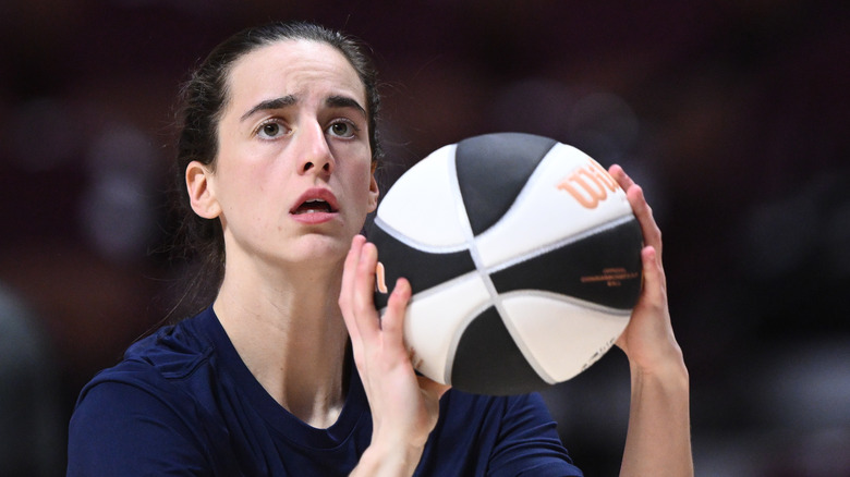 Caitlin Clark holding basketball