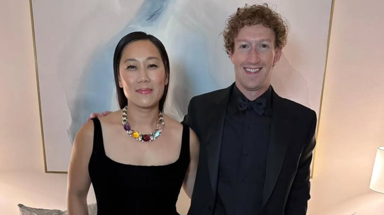 Priscilla Chan and Mark Zuckerberg posing in black