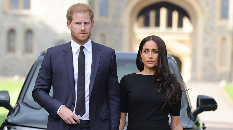 Prince Harry and Meghan Markle walking