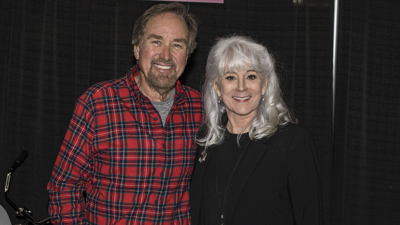 Richard Karn and Patricia Richardson pose together at a fan event.