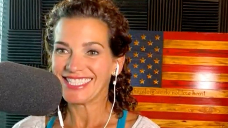 Wendy Bell in front of an American flag