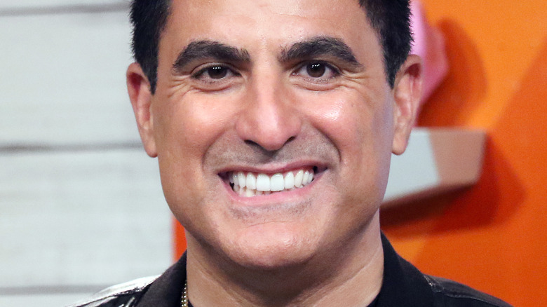 Reza Farahan smiling at camera