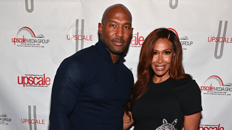 Sheree Whitfield; Tyrone Gilliams posing