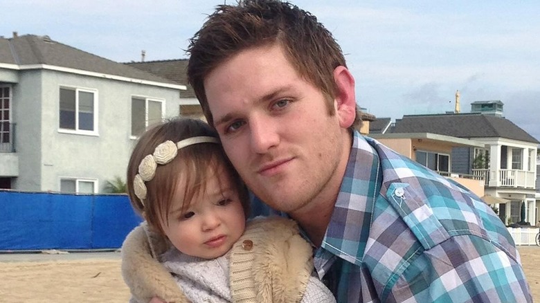 Josh Waring holding daughter Kennady