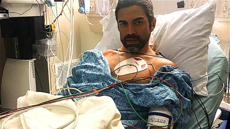 Eddie Judge lying in hospital bed