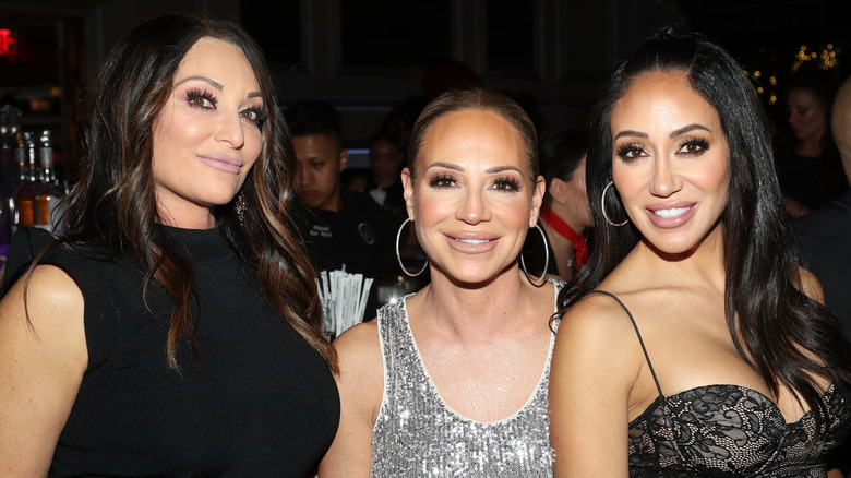 Melissa Gorga poses with her sisters Kim and Lysa in 2023,