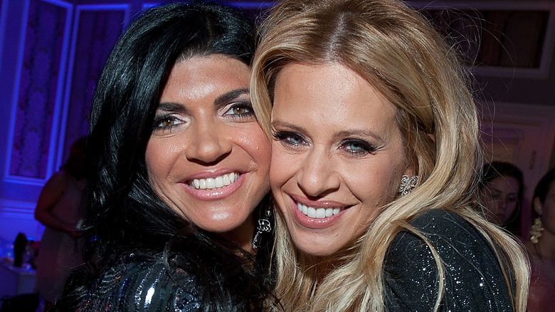 Teresa Giudice and Dina Manzo embrace in 2011