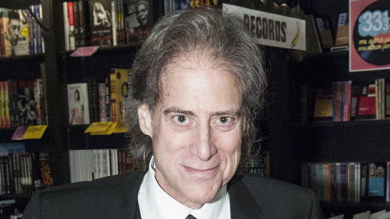 Richard Lewis posing for a photo in bookstore