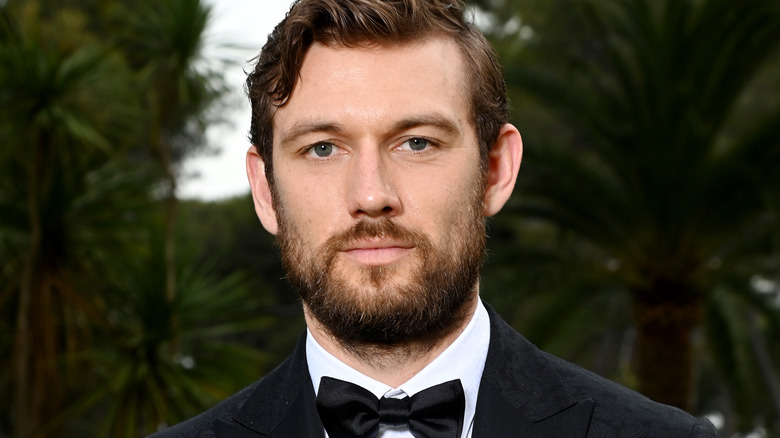 Alex Pettyfer posing in tuxedo