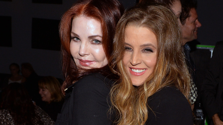 Priscilla Presley and Lisa Marie Presley black shirts