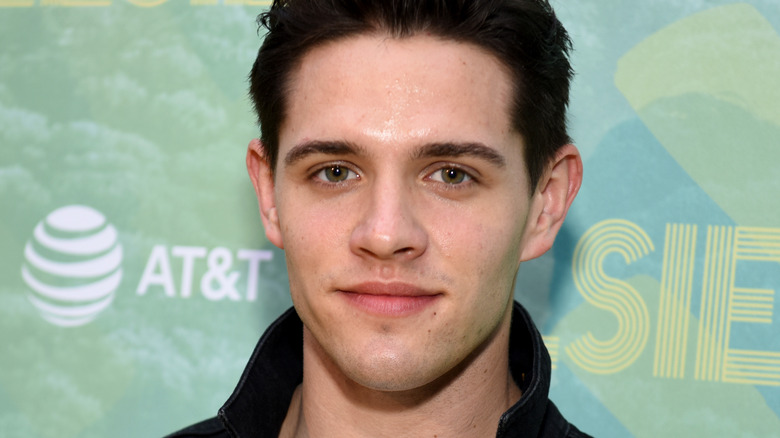 Casey Cott posing for cameras