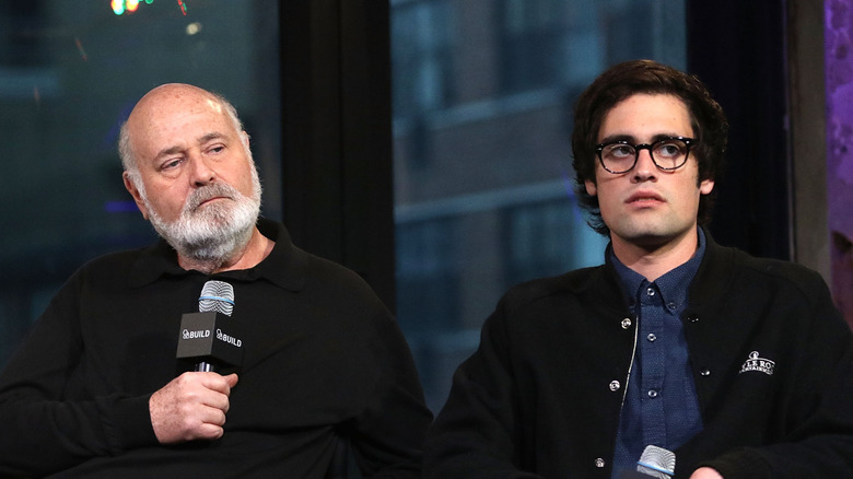 Rob Reiner sitting with Nick Reiner