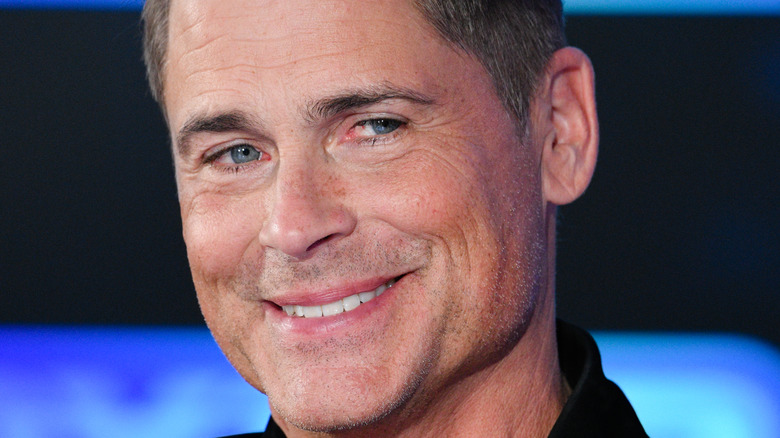 Rob Lowe smiling for photo