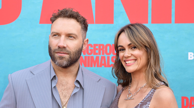 Jai Courtney and Dina Shihabi at the Dangerous Animals premiere in Los Angeles