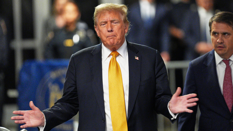 Donald Trump with arms outstretched