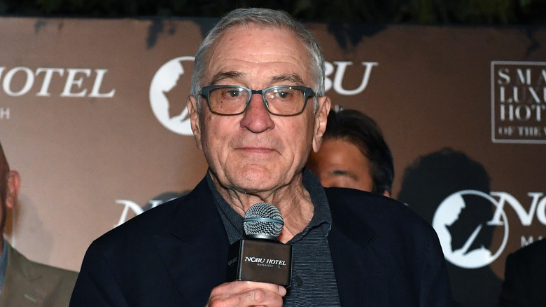 Robert De Niro holding microphone