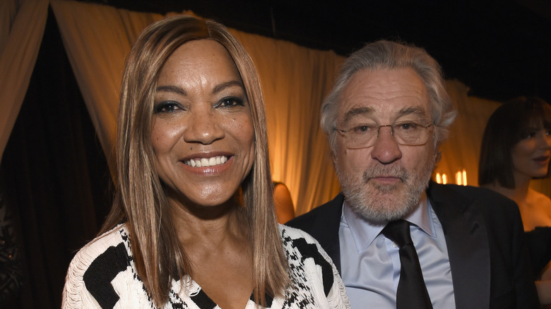 Grace Hightower and Robert De Niro stand side by side