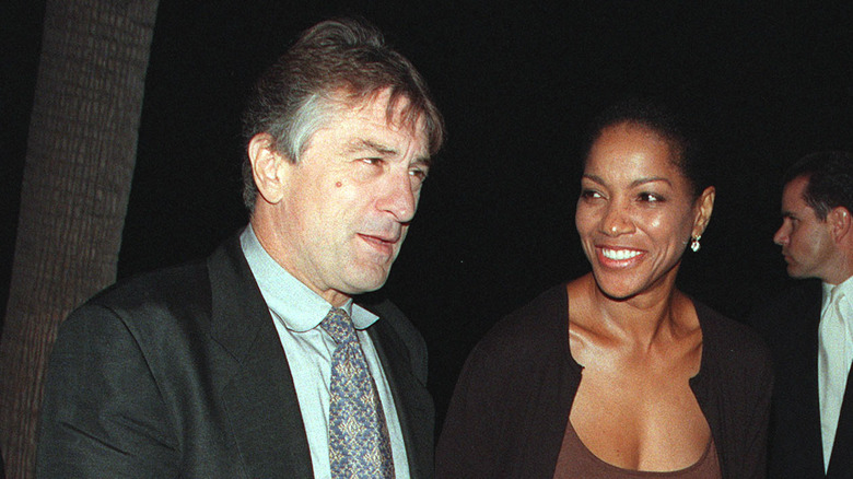 Robert De Niro walking with Grace Hightower