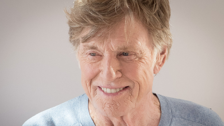 Robert Redford smiles in 2019