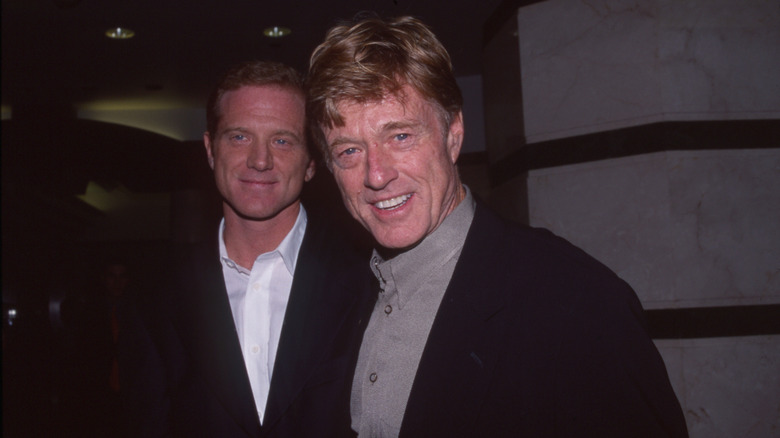 James and Robert Redford posing together in the 90s.