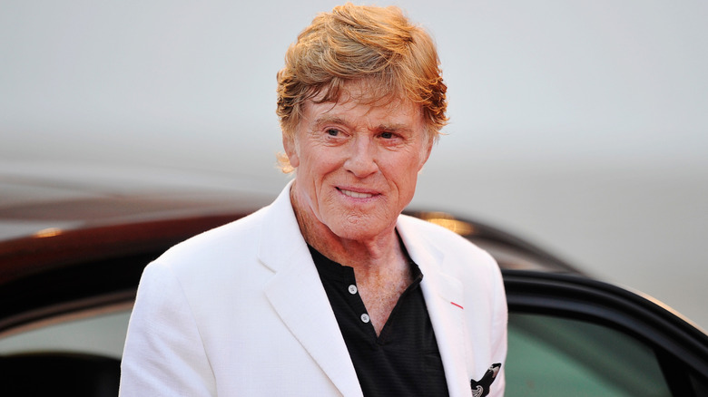 Robert Redford posing on the red carpet.