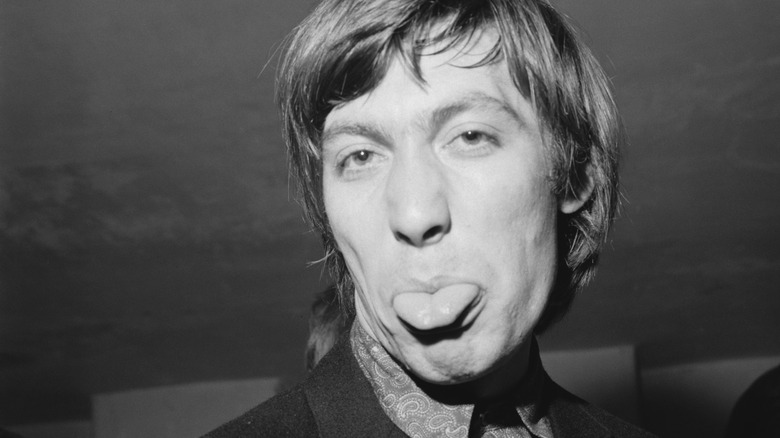 Charlie Watts sticking his tongue out