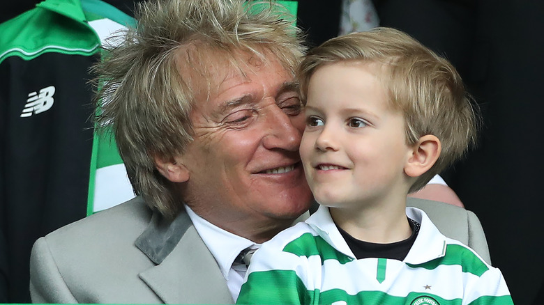 Rod Stewart holding Aiden Patrick