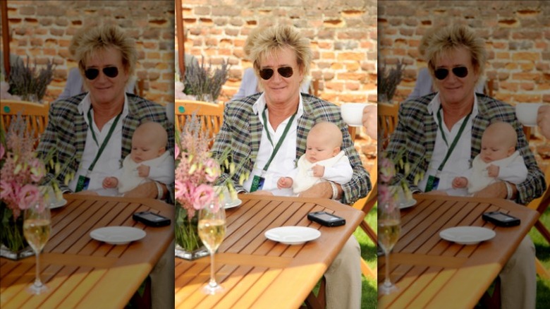 Rod Stewart holding Aiden Patrick
