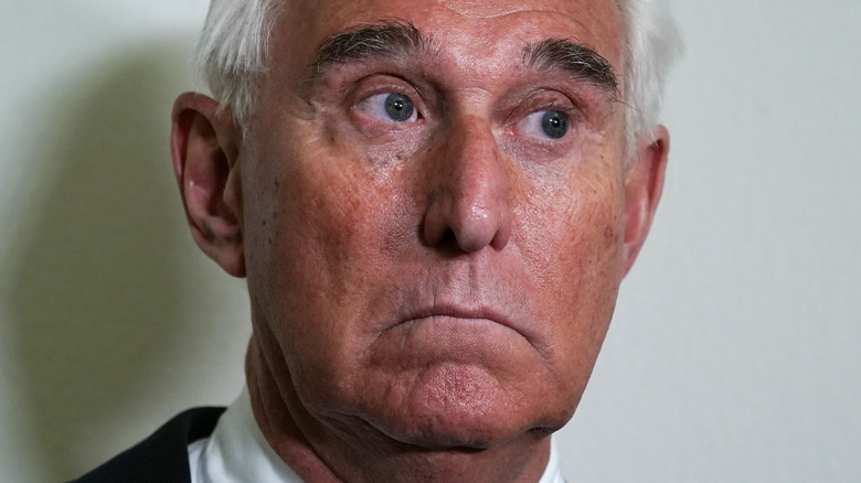 Roger Stone speaking to cameras outside a hearing