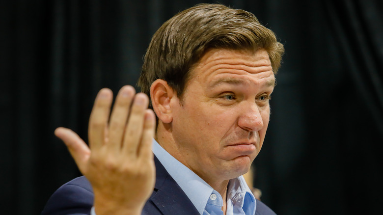 Ron DeSantis throwing hand up