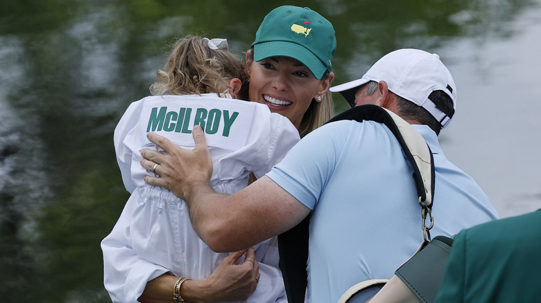 Erica Stoll embraces golf pro husband Rory McIlroy and daughter Poppy