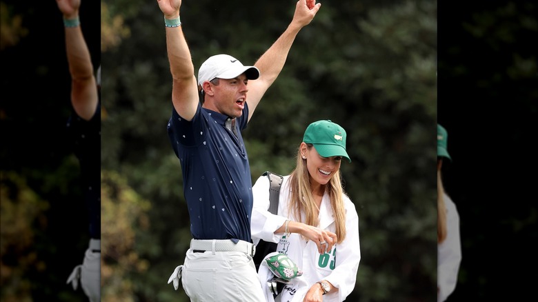 Rory McIlroy cheering with Erica Stoll