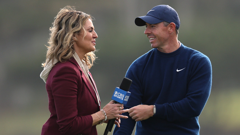 Amanda Balionis and Rory McIlroy talking.